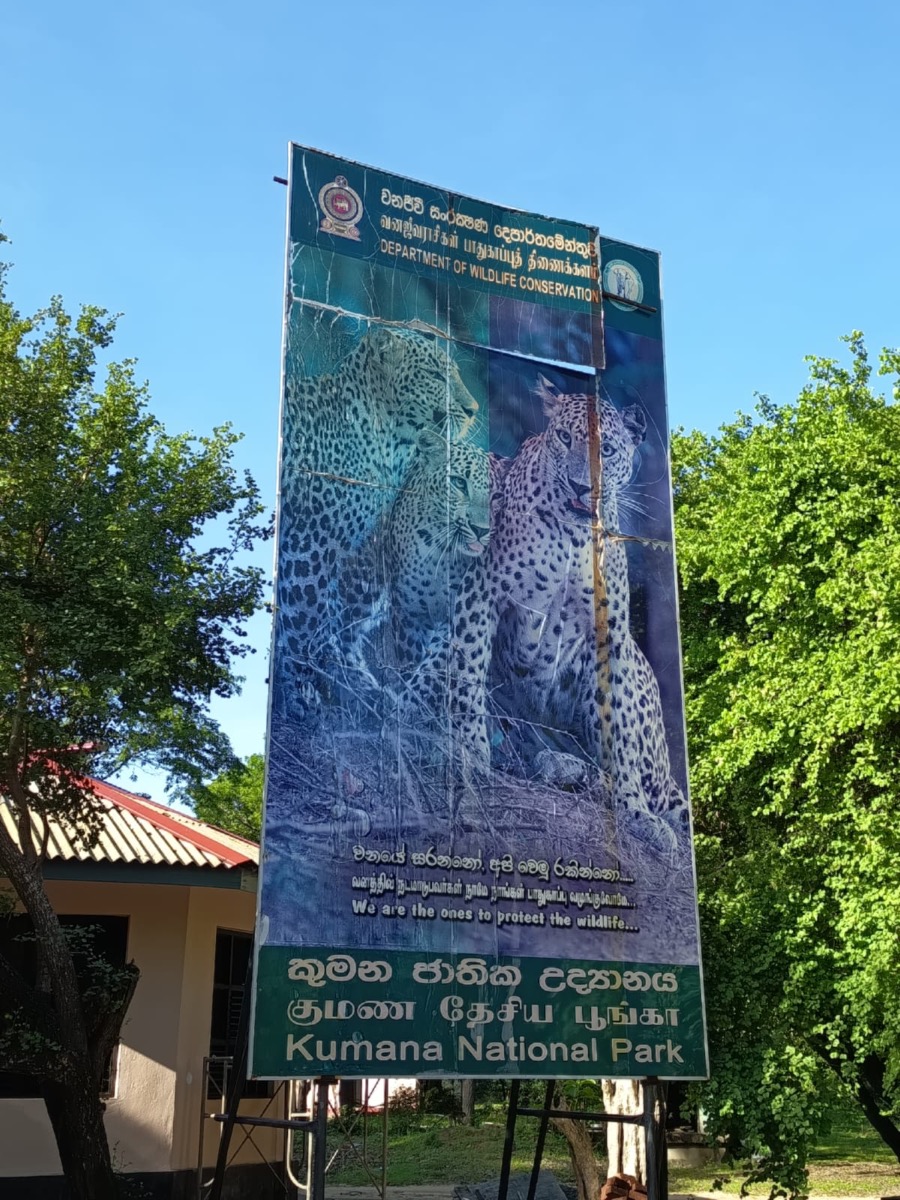 The Kumana National Park welcome board, painted with the park's leopards