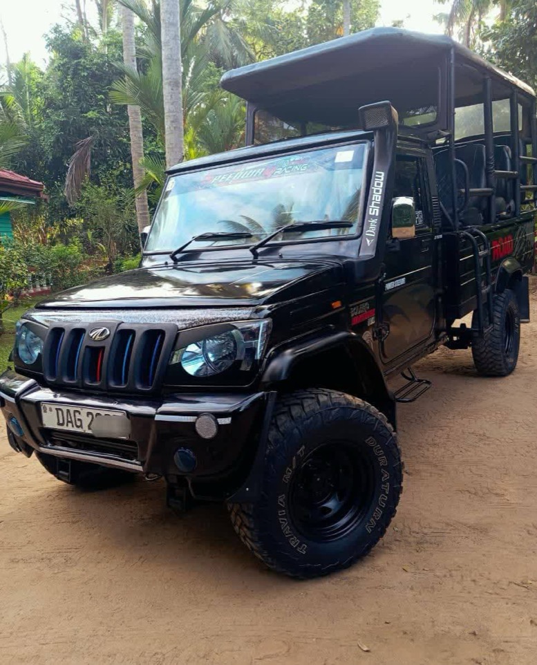 Sanka's open-top Mahindra safari jeep, ready for a game drive